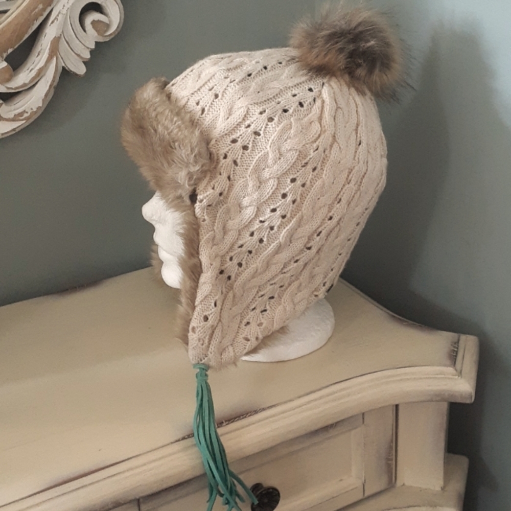 + Pistil cable knit and faux fur hat with ear flaps and tassels